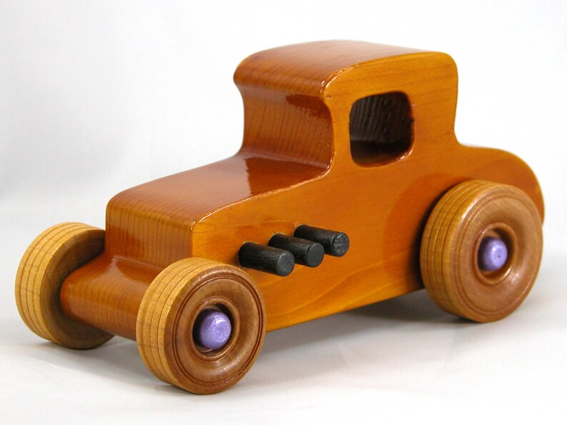 Handmade wooden toy car '27 T-Coupe, finished with amber shellac, metallic purple, and black acrylic paint. Made to order.