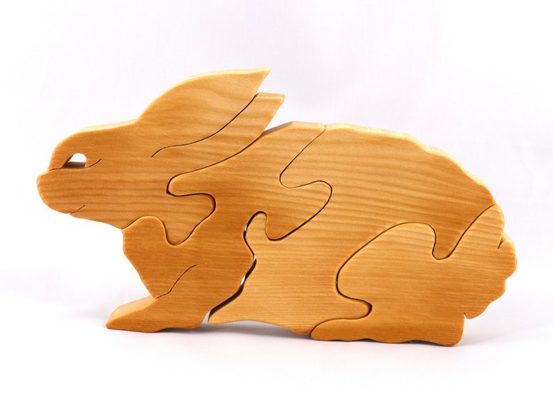 A wooden four piece puzzle in the shape of a rabbit. Perfect toddlers first puzzle.