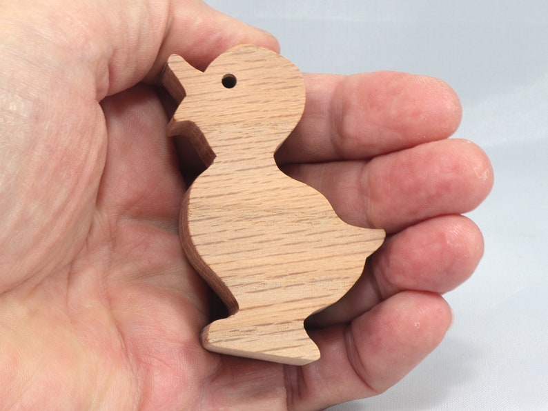 Wooden duck cutout, handmade, unfinished, and unpainted, from the Itty Bitty Animal Collection. Natural wood, freestanding, stackable, and paintable. Suitable for crafts or toys, American-made