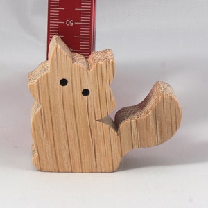 Handmade and unfinished, this stackable toy kitten cat cutout is ready to paint. This unpainted cutout is an excellent option for a fun DIY project or as a pretend toy for children. Available in several sizes, including custom orders.