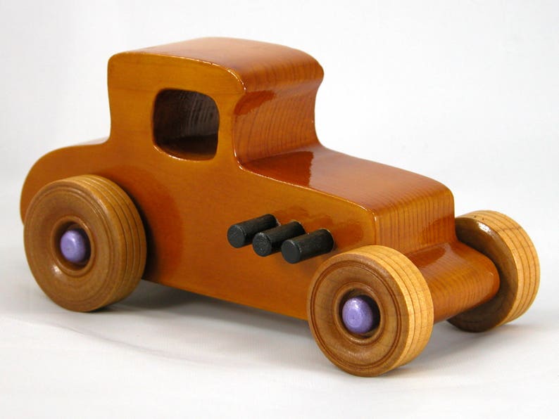 Handmade wooden toy car '27 T-Coupe, finished with amber shellac, metallic purple, and black acrylic paint. Made to order.