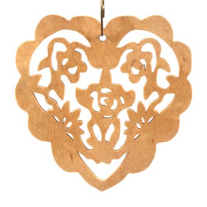 A handmade wooden Victorian-style fretwork floral heart Christmas tree ornament, featuring intricate cutout floral patterns in a heart shape, with a warm natural wood finish.