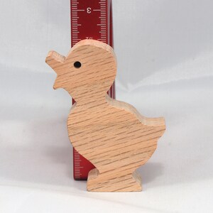 Wooden duck cutout, handmade, unfinished, and unpainted, from the Itty Bitty Animal Collection. Natural wood, freestanding, stackable, and paintable. Suitable for crafts or toys, American-made