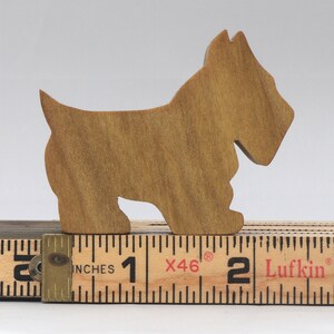 Handmade wooden Scottie dog toy cutout finished with mineral oil and beeswax blend. Freestanding stackable design from my Itty Bitty Animal Collection. Handcrafted in Tallahassee, Florida, USA from quality hardwood. Approximate size: length 2-1/2 inches, height 2 inches, width 3/4 inch. Each piece is unique with natural wood grain variations.
