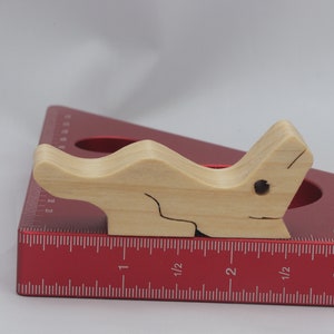 Handmade Wood Alligator Family Stacking Puzzle Mom and five baby (hatchling) alligators. This freestanding puzzle is hand-finished with a custom blend of mineral oil and waxes for a beautiful, smooth, and durable finish.