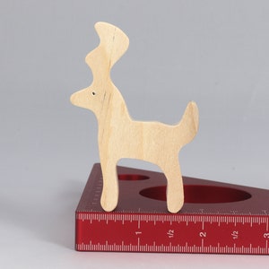 Handmade unfinished wooden deer toy figurine, part of the Itty Bitty Animal Collection, shown in natural light wood with visible grain, standing on a white background.