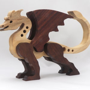 Handmade wood dragon figurine made from select grade contrasting hardwoods and hand-finished with a custom mixture of mineral oil and waxes.