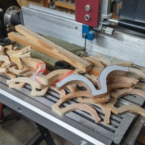 Odin' Toy Factory Toymakers Shop Photo - A collection of unfinished wooden fenders on my Shopsmith bandsaw. The original fenders were to thick and hade to resawn.