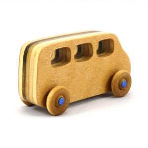 Handmade wood toy minivan made by me in my shop using traditional woodworking tools. It is hand finished with clear shellac with metallic sapphire blue acrylic paint.