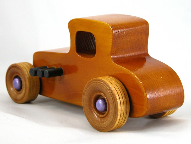 Handmade wooden toy car '27 T-Coupe, finished with amber shellac, metallic purple, and black acrylic paint. Made to order.