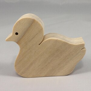 This is an unfinished wooden Duck cutout from solid wood using traditional woodworking techniques. Sanded smooth and ready to paint, stain, or customize. Freestanding design for small hands, toddlers, young children, crafters, collectors, and display. I take custom orders for any animal, quantity, and mix — including large ornament orders. Mix and match, request a different size, or send a drawing or pattern. Handmade by Odin's Toy Factory in Tallahassee, Florida, USA.
