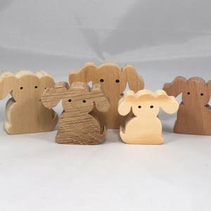 Handmade, stackable toy puppy dog cutout from the Itty Bitty Animal Collection. Unfinished and unpainted, crafted for creative play. Smoothly sanded and ready to be personalized with your favorite colors.