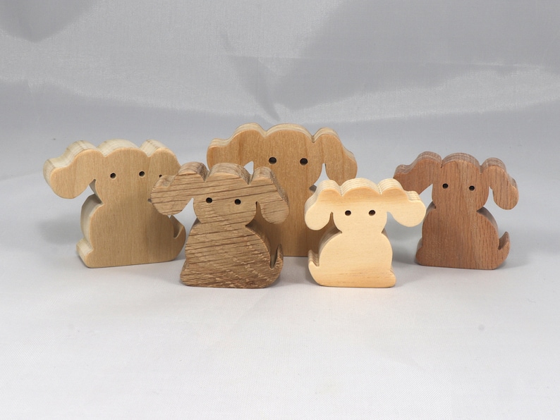 Handmade, stackable toy puppy dog cutout from the Itty Bitty Animal Collection. Unfinished and unpainted, crafted for creative play. Smoothly sanded and ready to be personalized with your favorite colors.