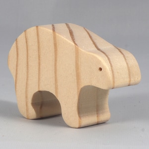This is an unfinished wooden bear cutout from solid wood using traditional woodworking techniques. Sanded smooth and ready to paint, stain, or customize. Freestanding design for small hands, toddlers, young children, crafters, collectors, and display. I take custom orders for any animal, quantity, and mix — including large ornament orders. Mix and match, request a different size, or send a drawing or pattern. Handmade by Odin's Toy Factory in Tallahassee, Florida, USA.