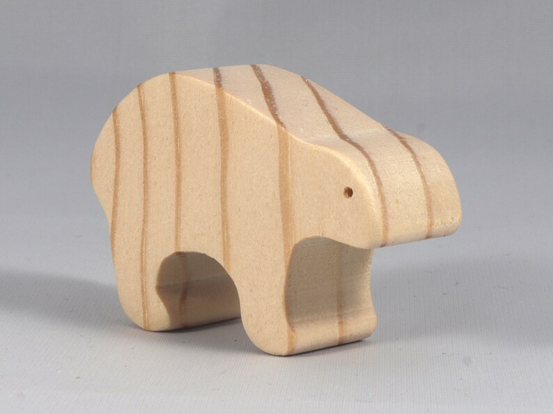 This is an unfinished wooden bear cutout from solid wood using traditional woodworking techniques. Sanded smooth and ready to paint, stain, or customize. Freestanding design for small hands, toddlers, young children, crafters, collectors, and display. I take custom orders for any animal, quantity, and mix — including large ornament orders. Mix and match, request a different size, or send a drawing or pattern. Handmade by Odin's Toy Factory in Tallahassee, Florida, USA.