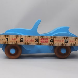Handmade painted wooden toy car, baby blue convertible with fat fendered roadster design. Non-marring wheels finished with amber shellac.