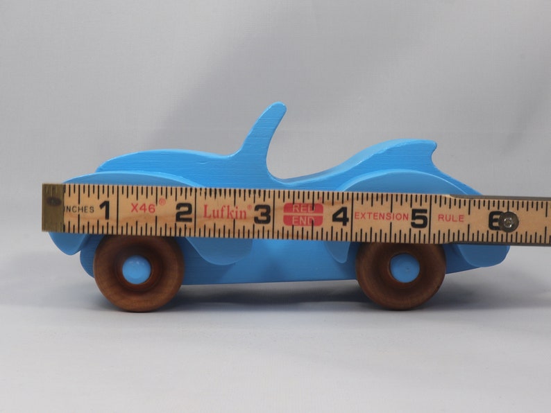 Handmade painted wooden toy car, baby blue convertible with fat fendered roadster design. Non-marring wheels finished with amber shellac.