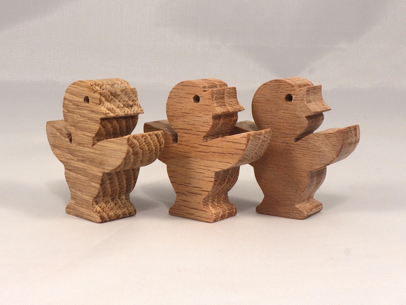 This is an unfinished wooden Singing Bird cutout from solid wood using traditional woodworking techniques. Sanded smooth and ready to paint, stain, or customize. Freestanding design for small hands, toddlers, young children, crafters, collectors, and display. I take custom orders for any animal, quantity, and mix — including large ornament orders. Mix and match, request a different size, or send a drawing or pattern. Handmade by Odin's Toy Factory in Tallahassee, Florida, USA.