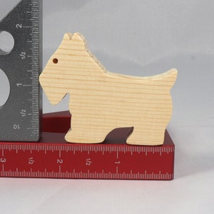Handmade wood toy Scottie dog cutout unfinished unpainted paintable freestanding Itty Bitty Animal Collection. Approximate size 2.5 inches length by 2 inches height by 0.75 inches width. Handmade in Tallahassee Florida USA from natural wood offcuts.