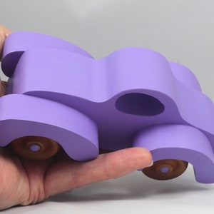 A Handmade Wood Toy Car Fat Fendered Coupe Hand Painted With Amethyst Acrylic Paint And Amber Shellac
