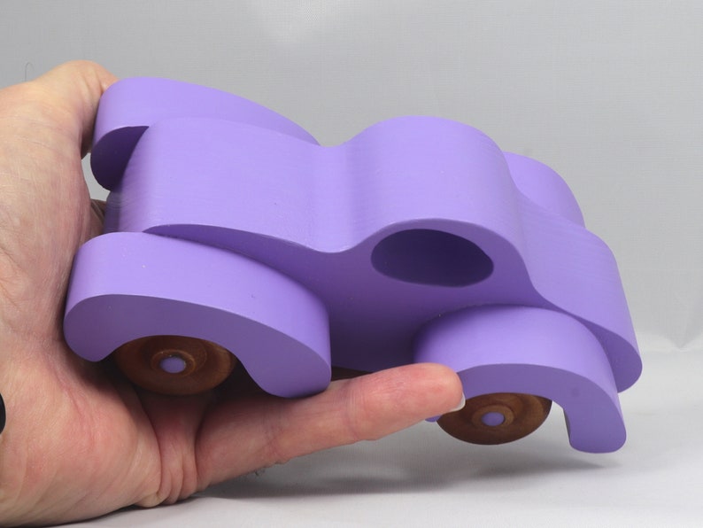 A Handmade Wood Toy Car Fat Fendered Coupe Hand Painted With Amethyst Acrylic Paint And Amber Shellac