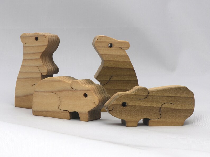Handmade Wooden Stacking Puzzle Guinea Pig Family, Mom, and Babies finished with a non-toxic custom blend of mineral oil and waxes. This wooden toy animal is perfect for imaginative play and an excellent gift for children.