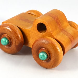 Wood Toy Monster Pickup Truck handmade in the USA from select hardwood finished with amber shellac with metallic emerald green trim. From my Play Pal Collection.