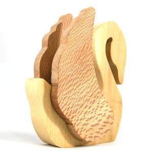Handmade wooden swan figurine crafted from contrasting reclaimed hardwoods, sanded and ready to finish, and made in the USA.