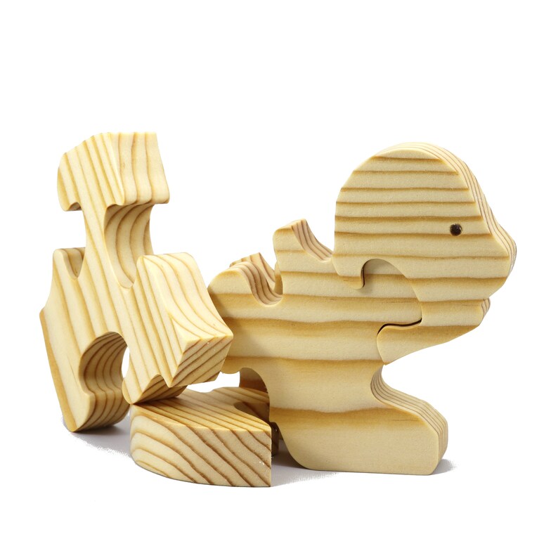 Handmade wooden turtle puzzle with 5 simple interlocking pieces. Freestanding 5-piece wooden puzzle. Approximate dimensions: 5 inches high by 7.25 inches long by 0.75 inches thick. Finished with mineral oil and beeswax blend. Handcrafted in Tallahassee, Florida, USA, using natural wood. Unique wood grain color and knot variations. Odin’s Toy Factory.