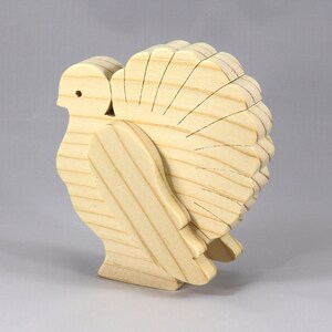 Handmade 3D layered freestanding wooden turkey figurine, unfinished and unpainted. Perfect for Thanksgiving decor, crafts, or as a toy.