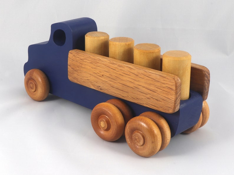 This handmade wooden Lorry truck is finished with navy blue acrylic paint and Amber Shellac. It is one of five towable trucks in this collection, available in many colors and unfinished. Custom Orders are welcome.