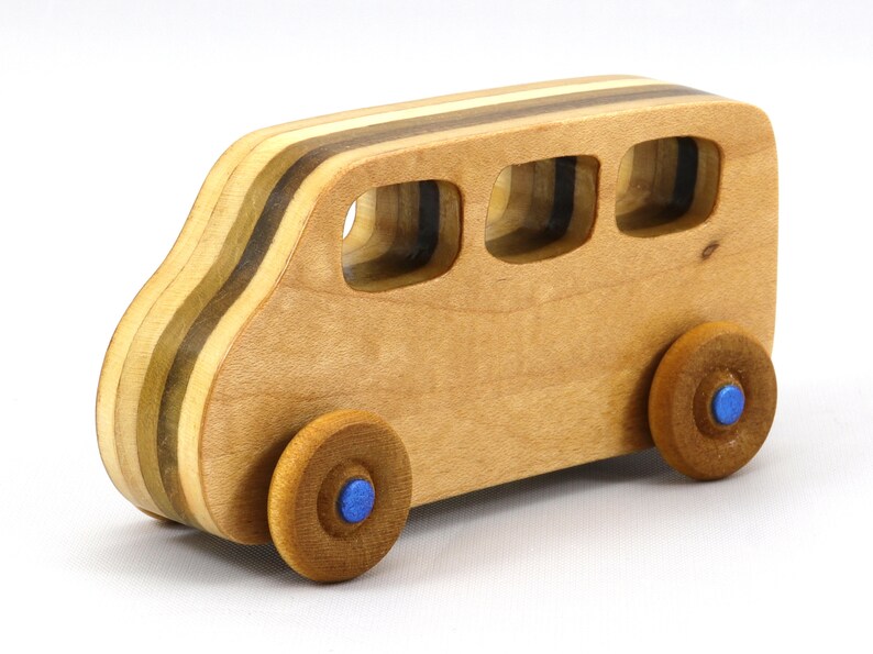 Handmade wood toy minivan made by me in my shop using traditional woodworking tools. It is hand finished with clear shellac with metallic sapphire blue acrylic paint.