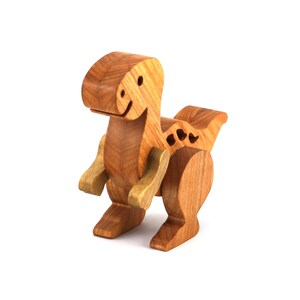 A wooden baby dinosaur figurine handmade and finished from select-grade hardwoods. It is an excellent toy for kids of any age. It is one of several dinosaurs in my collection.
