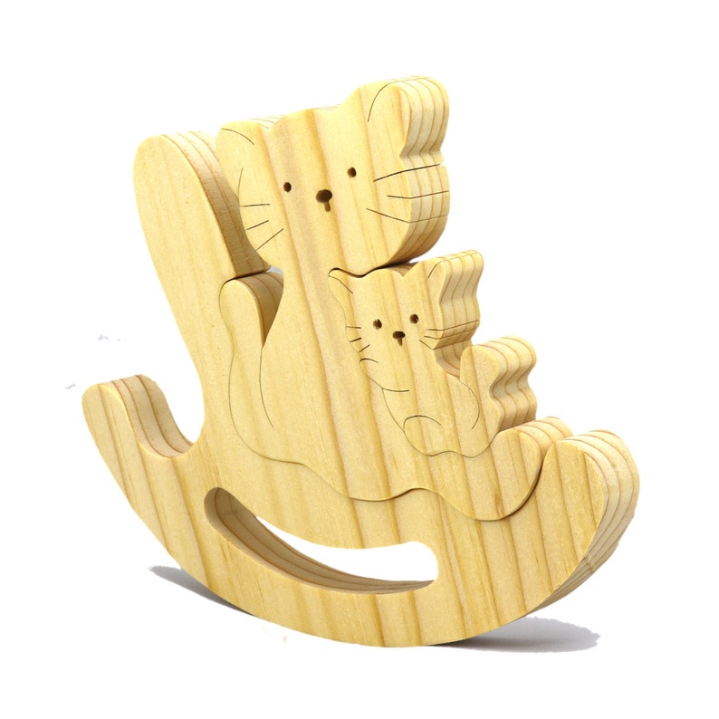 Handmade Wood Puzzle featuring Moma Cat and Baby Kitten in a Rocker, a simple three-part design crafted with traditional woodworking tools. Smoothly sanded and finished with a blend of mineral oil and beeswax for a lustrous touch.