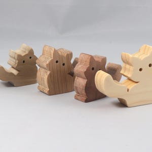 This is an unfinished wooden Fluffy Kitten cutout from solid wood using traditional woodworking techniques. Sanded smooth and ready to paint, stain, or customize. Freestanding design for small hands, toddlers, young children, crafters, collectors, and display. I take custom orders for any animal, quantity, and mix — including large ornament orders. Mix and match, request a different size, or send a drawing or pattern. Handmade by Odin's Toy Factory in Tallahassee, Florida, USA.