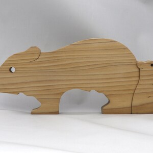 Handmade Wooden Stacking Puzzle Guinea Pig Family, Mom, and Babies finished with a non-toxic custom blend of mineral oil and waxes. This wooden toy animal is perfect for imaginative play and an excellent gift for children.