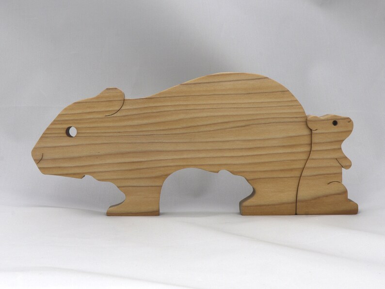 Handmade Wooden Stacking Puzzle Guinea Pig Family, Mom, and Babies finished with a non-toxic custom blend of mineral oil and waxes. This wooden toy animal is perfect for imaginative play and an excellent gift for children.