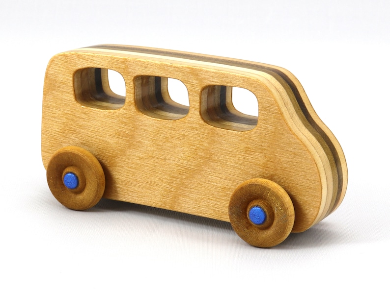 Handmade wood toy minivan made by me in my shop using traditional woodworking tools. It is hand finished with clear shellac with metallic sapphire blue acrylic paint.