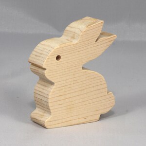 This is an unfinished wooden Rabbit cutout from solid wood using traditional woodworking techniques. Sanded smooth and ready to paint, stain, or customize. Freestanding design for small hands, toddlers, young children, crafters, collectors, and display. I take custom orders for any animal, quantity, and mix — including large ornament orders. Mix and match, request a different size, or send a drawing or pattern. Handmade by Odin's Toy Factory in Tallahassee, Florida, USA.