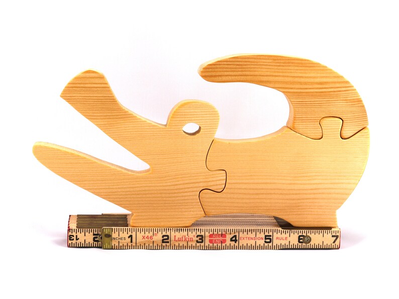A 10-inch long wooden alligator puzzle for younger kids handmade and smoothly finished. This simple puzzle has three pieces, easy-to-grasp, interlocking, chunky, freestanding pieces. It is made to order.