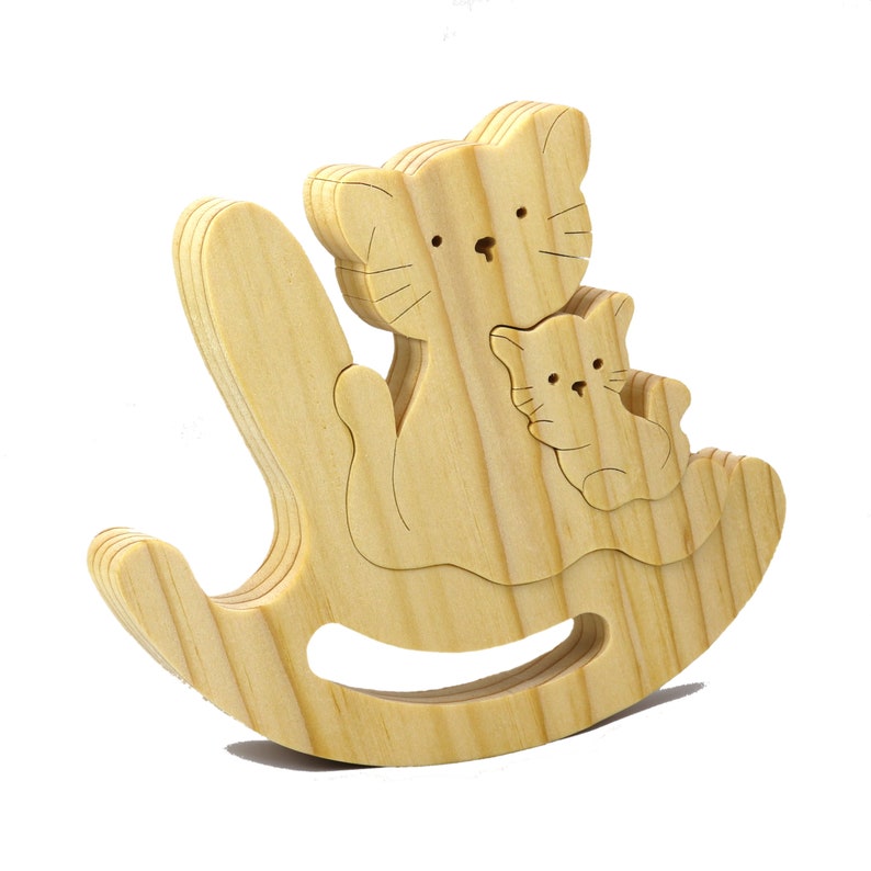 Handmade Wood Puzzle featuring Moma Cat and Baby Kitten in a Rocker, a simple three-part design crafted with traditional woodworking tools. Smoothly sanded and finished with a blend of mineral oil and beeswax for a lustrous touch.