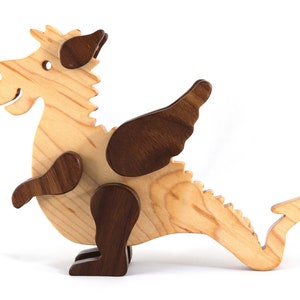 Handmade wood baby dragon fantasy animal figurine made from select grade contrasting hardwoods and hand finished with a durable custom blend of mineral oil and waxes.