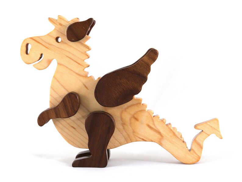 Handmade wood baby dragon fantasy animal figurine made from select grade contrasting hardwoods and hand finished with a durable custom blend of mineral oil and waxes.