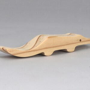 Handmade toy alligator cutout from the Itty Bitty Animal Collection. Crafted with traditional woodworking tools, this unfinished wood alligator is freestanding, smooth-sanded, and ready to paint. Perfect for stacking and imaginative play.