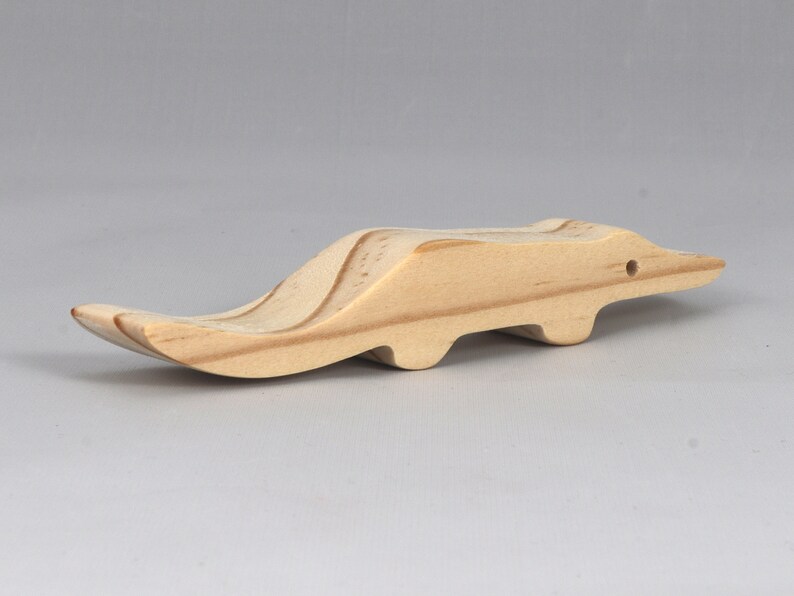 Handmade toy alligator cutout from the Itty Bitty Animal Collection. Crafted with traditional woodworking tools, this unfinished wood alligator is freestanding, smooth-sanded, and ready to paint. Perfect for stacking and imaginative play.