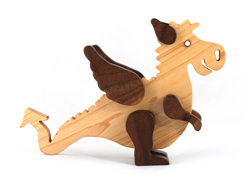 Handmade wood baby dragon fantasy animal figurine made from select grade contrasting hardwoods and hand finished with a durable custom blend of mineral oil and waxes.