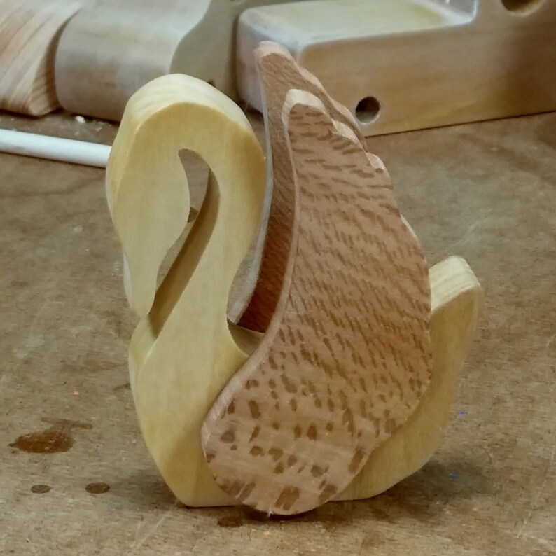 Handmade wooden swan figurine crafted from contrasting reclaimed hardwoods, sanded and ready to finish, and made in the USA.