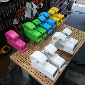 Odin's Toy Factory Toymakers Shop Photo - This is a group of car bodies from my Bad Bob’s Custom Motors collection in various stages of finishing. The cars are pink, green, blue, yellow, and white primer.