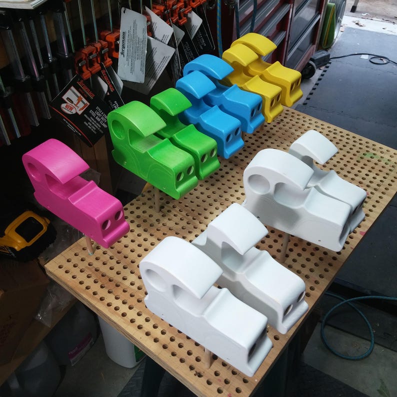 Odin's Toy Factory Toymakers Shop Photo - This is a group of car bodies from my Bad Bob’s Custom Motors collection in various stages of finishing. The cars are pink, green, blue, yellow, and white primer.