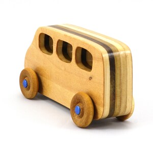 Handmade wood toy minivan made by me in my shop using traditional woodworking tools. It is hand finished with clear shellac with metallic sapphire blue acrylic paint.